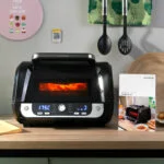 Cvrtnik na vroči zrak z žarom, dodatki in knjigo receptov InnovaGoods Air Fryer Fryinn 12-in-1 6000 Črna Jeklo 6 L 3400 W